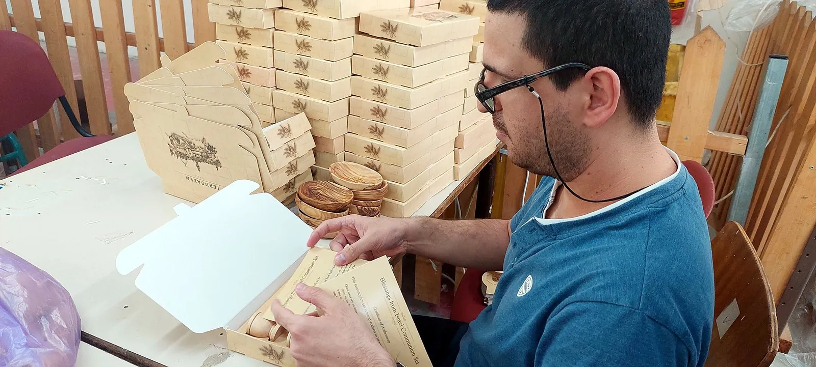 Olive wood communion sets packed with certificates of authenticity for a year-end donor campaign